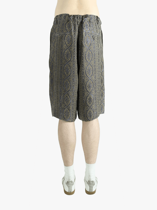 Blue pants worn by a person, showing the pants' fit