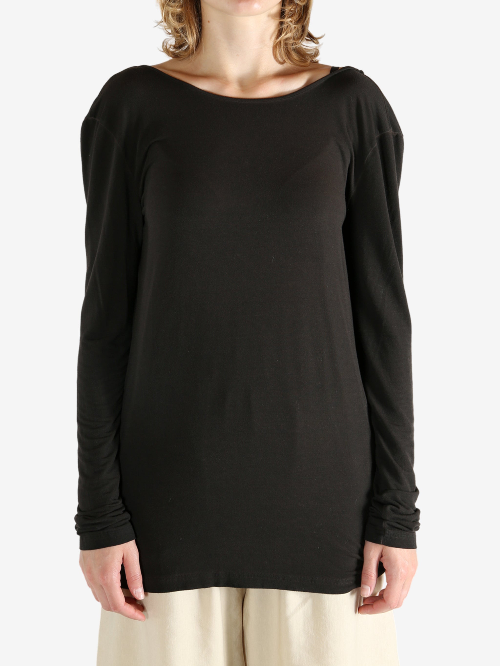 Brown top worn by a person, showing the top fit