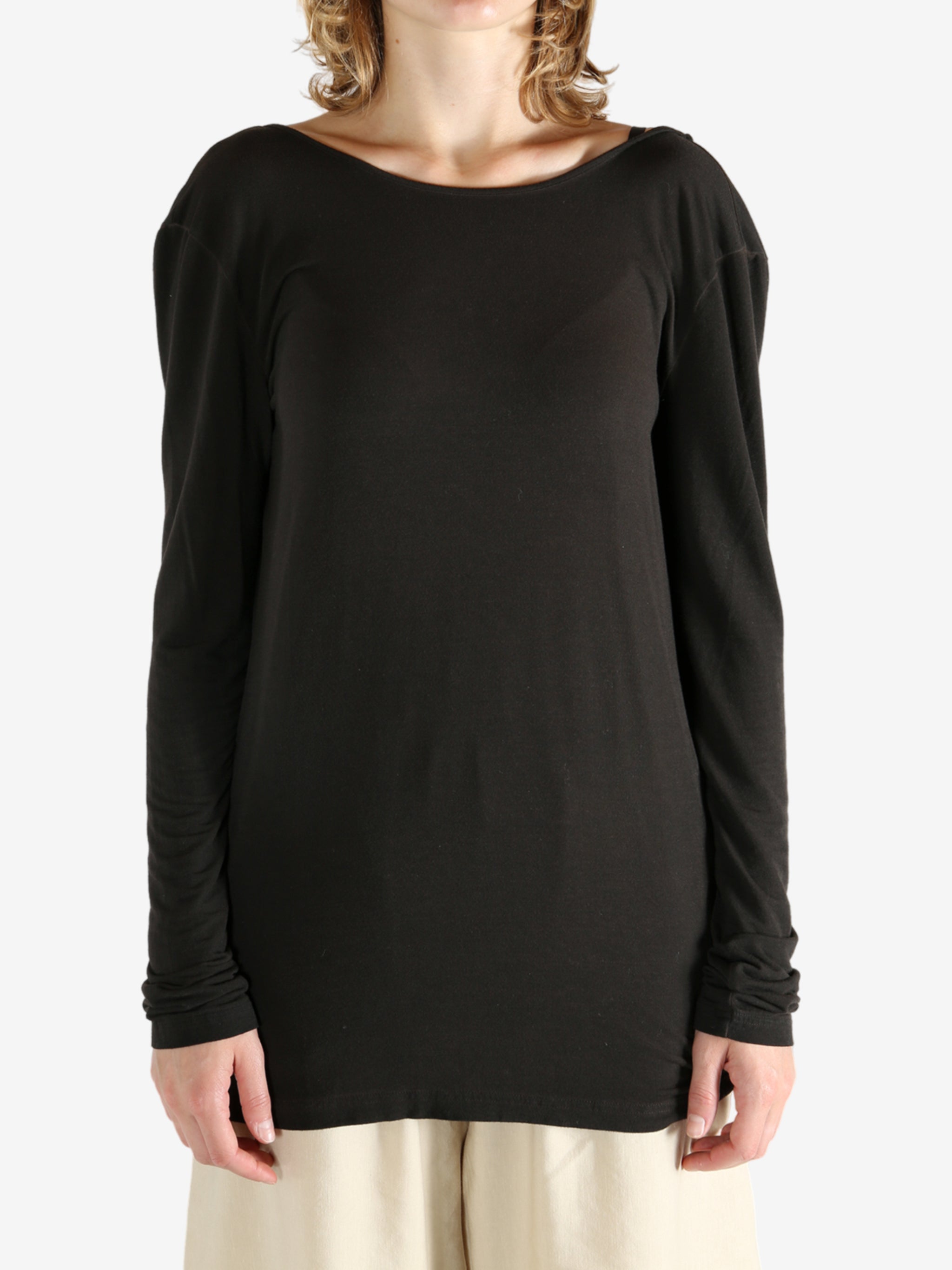 Brown top worn by a person, showing the top fit