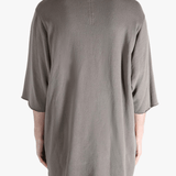 Tan t-shirts worn by a person, showing the t-shirts fit