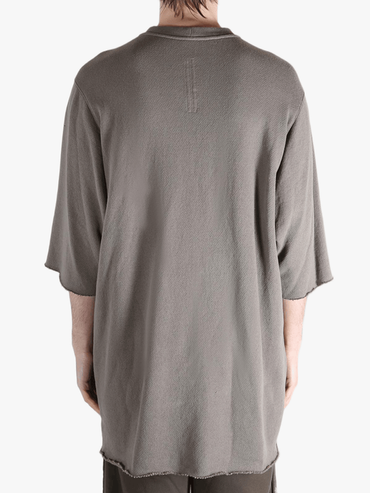 Tan t-shirts worn by a person, showing the t-shirts fit