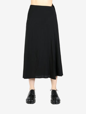 Black skirt worn by a person, showing the skirt’s fit