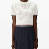 White t-shirt worn by a person, showing texture of t-shirt's fit