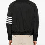 Black jacket worn by a person, showing the jacket fit