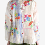 Tan top worn by a person, showing the top's fit