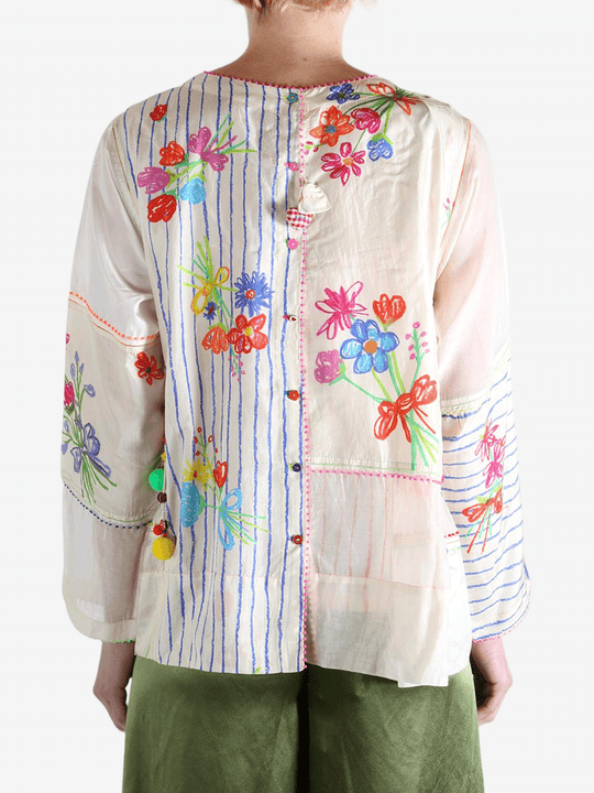 Tan top worn by a person, showing the top's fit