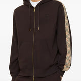 Brown hoodie worn by a person, showing the hoodie's fit
