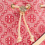 Close up of red bag, showing texture of the leather fabric