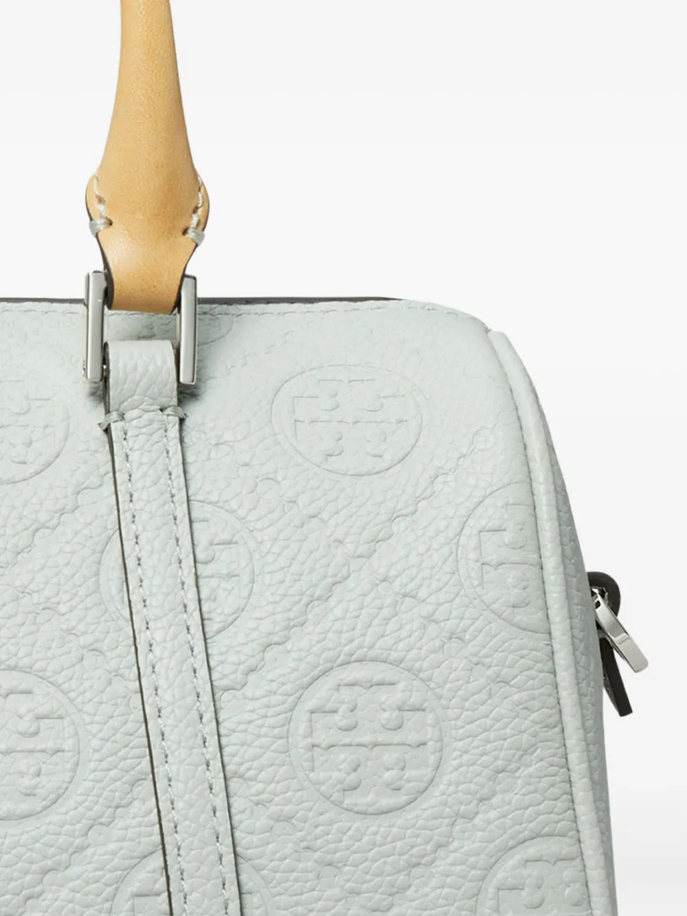 Close up of green bag, showing texture of the leather fabric