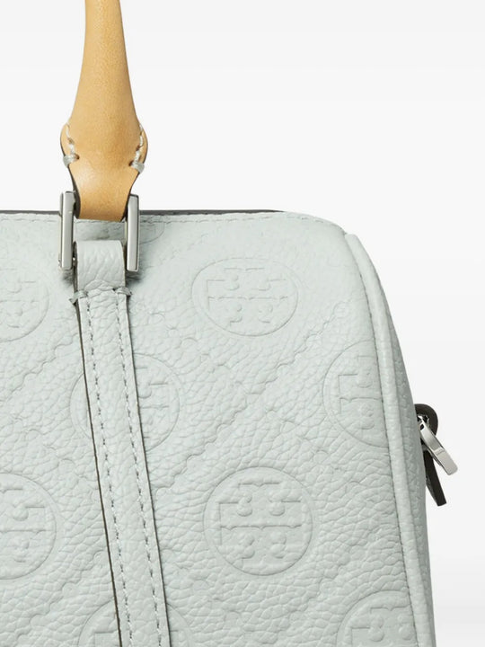 Close up of green bag, showing texture of the leather fabric