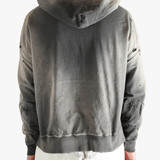 Grey sweats-hoodies worn by a person, showing the sweats-hoodies's fit