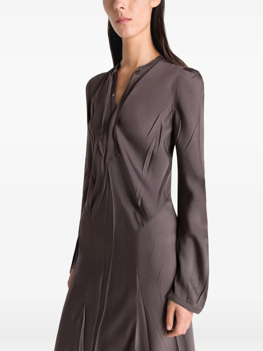 Brown dresses worn by a person, showing the dresses fit