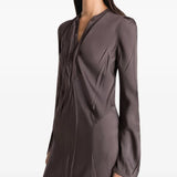 Brown dresses worn by a person, showing the dresses fit