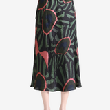 Green skirt worn by a person, showing the skirt fit