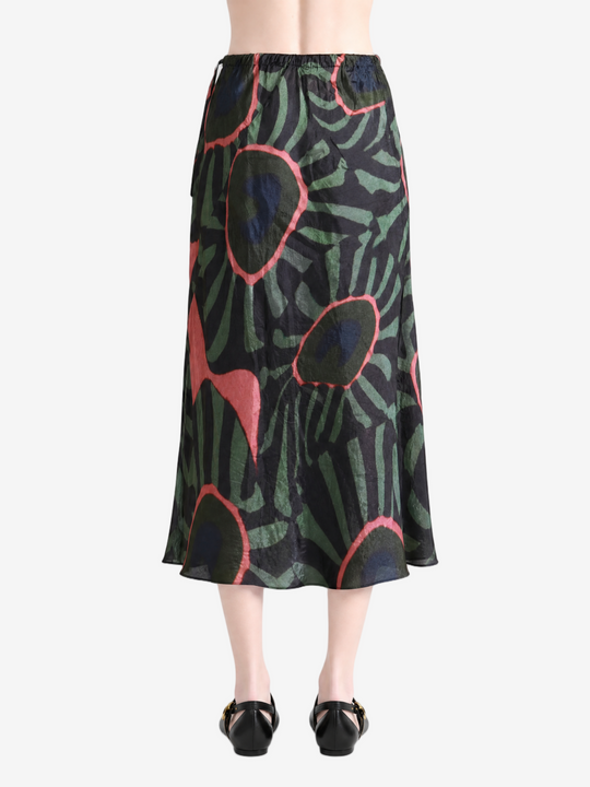 Green skirt worn by a person, showing the skirt fit