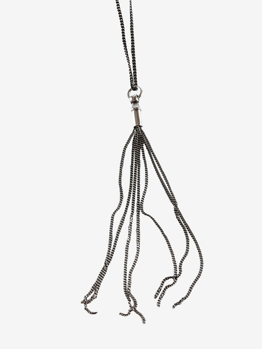 Close up of black necklace, showing texture of the silver fabric