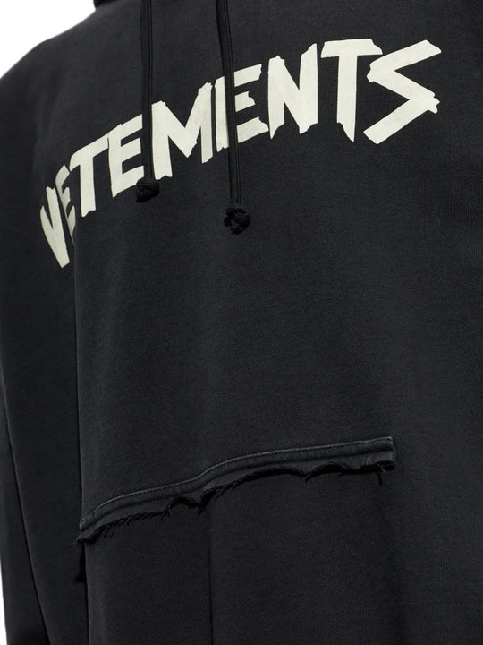 Close up of Black hoodie, showing texture of the 100% cotton fabric