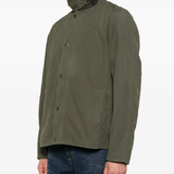 Green jacket worn by a person, showing the jacket's fit
