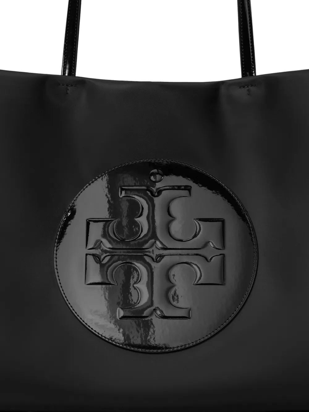 Close up of black bags, showing texture of the recycled polyester and leather fabric