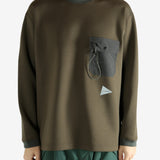 Brown pullover worn by a person, showing the pullover 's fit