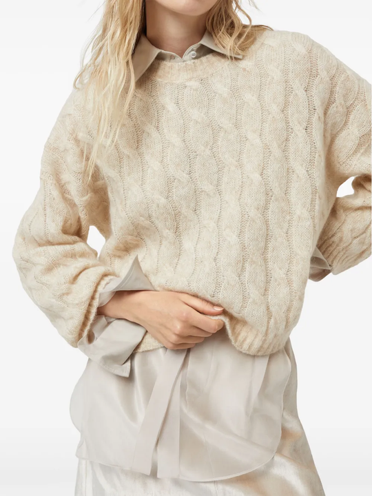 Tan knitwears worn by a person, showing the knitwears fit