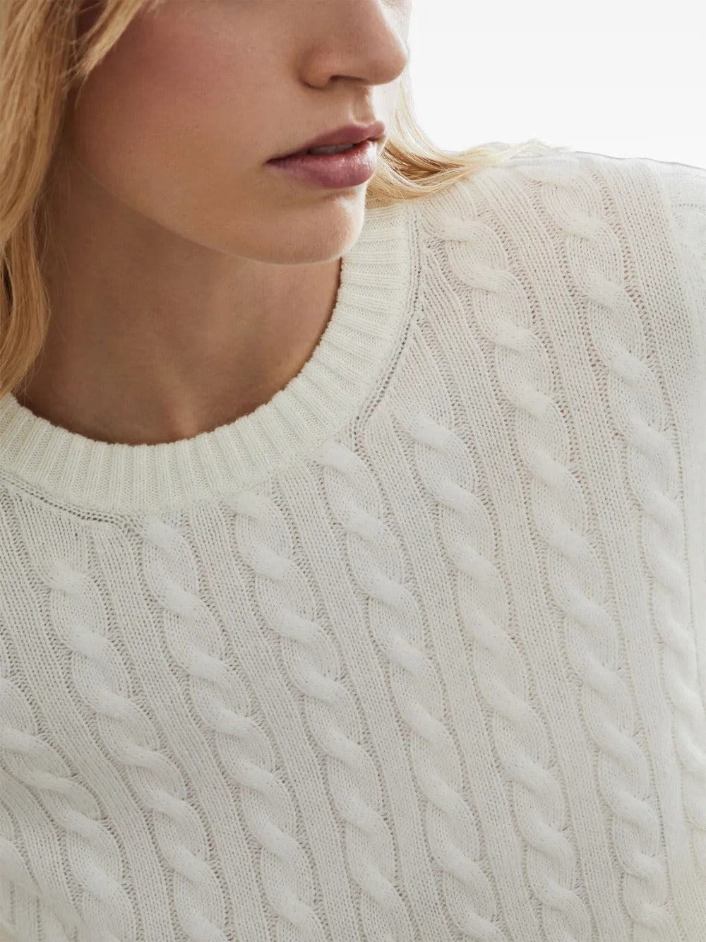 Close up of the white knitwear, showing texture of the cashmere fabric