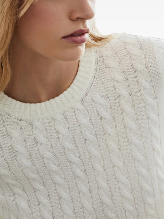 Close up of the white knitwear, showing texture of the cashmere fabric