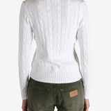 White knitwear worn by a person, showing the knitwear's fit