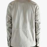 Grey jacket worn by a person, showing the jacket fit