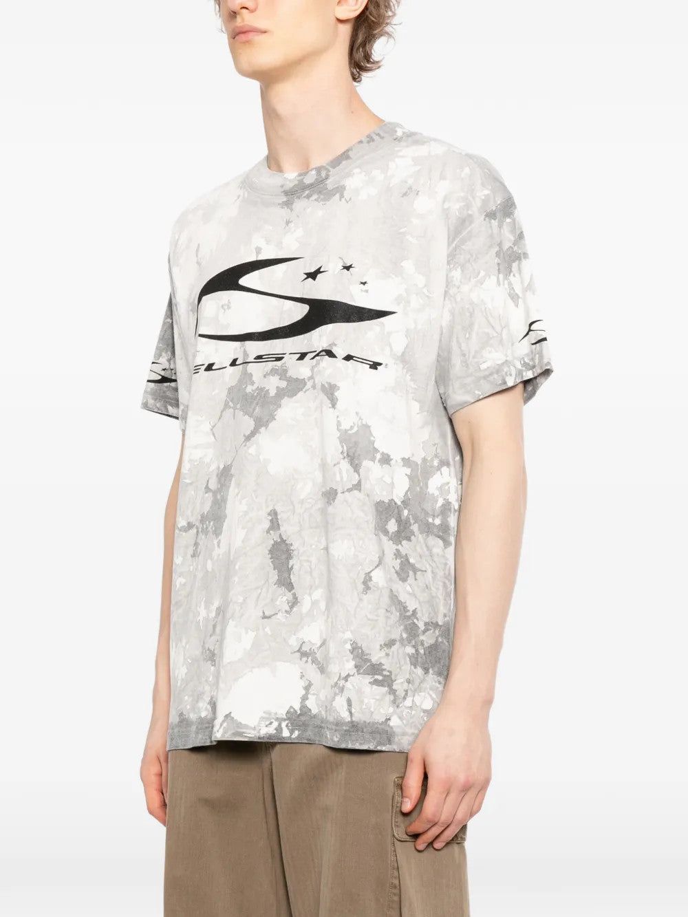 Grey t-shirt worn by a person, showing the t-shirt fit