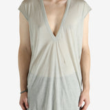 White t-shirt worn by a person, showing the shirt's fit