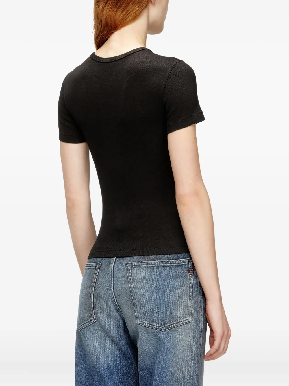 black top worn by a person, showing the top fit
