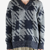 Blue sweater worn by a person, showing the sweater fit