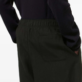 close up of black pants, showing texture of the linen fabric