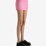 Pink skirt worn by a person, showing the skirt's fit