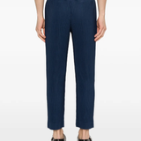 blue pants worn by a person, showing the pants fit