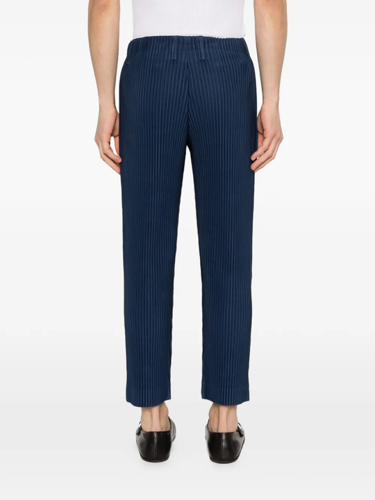 blue pants worn by a person, showing the pants fit