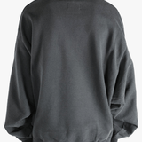 Black shirt worn by a person, showing the shirt's fit