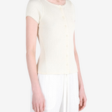 Tan knitwear worn by a person, showing the knitwear fit