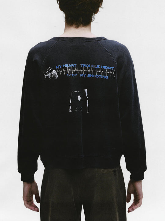 Black sweatshirt worn by a person, showing the sweatshirt's fit