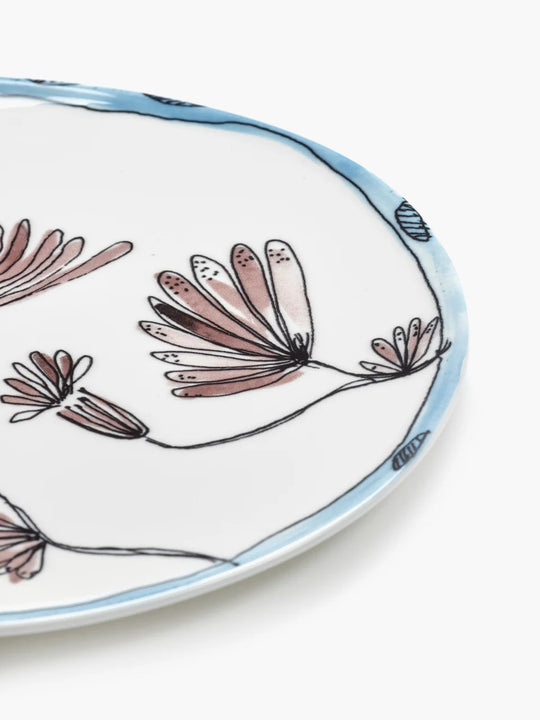 Close up of blue plate, showing texture of the bone porcelain fabric