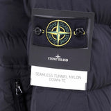 Close up of black coat, showing texture of the nylon fabric