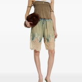 Brown top worn by a person, showing the top's fit