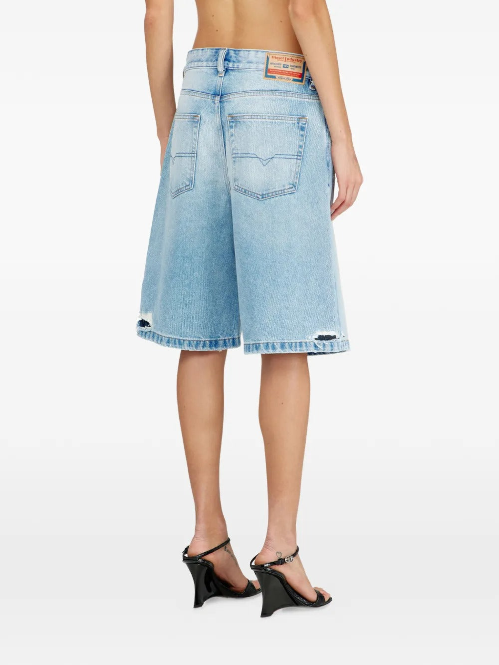 Blue shorts worn by a person, showing the shorts fit