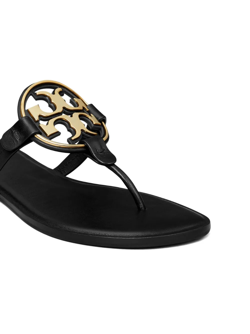 Close up of black sandal , showing texture of the Calf Leather and Rubber fabric