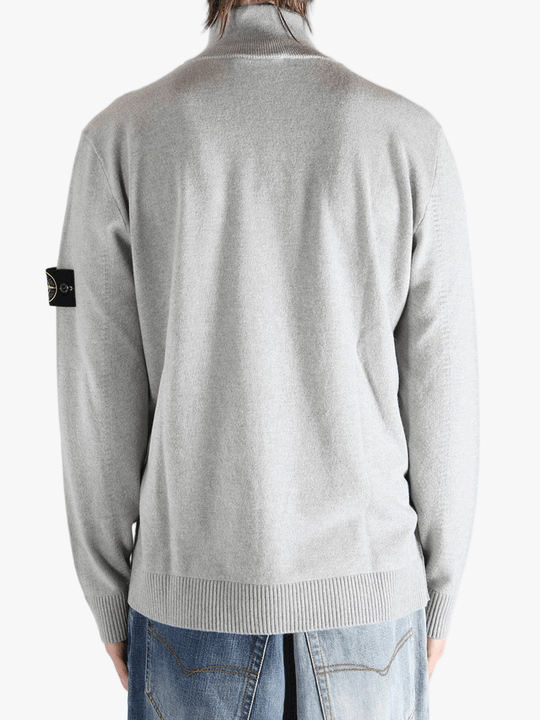 Gray sweater worn by a person, showing the sweater fit