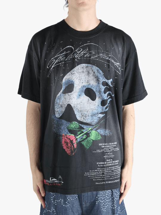 Black t-shirts worn by a person, showing the t-shirts fit
