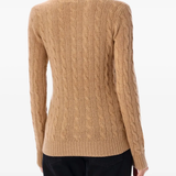 Brown knitwear worn by a person, showing the knitwear's fit