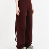 Burgundy pants, full body view