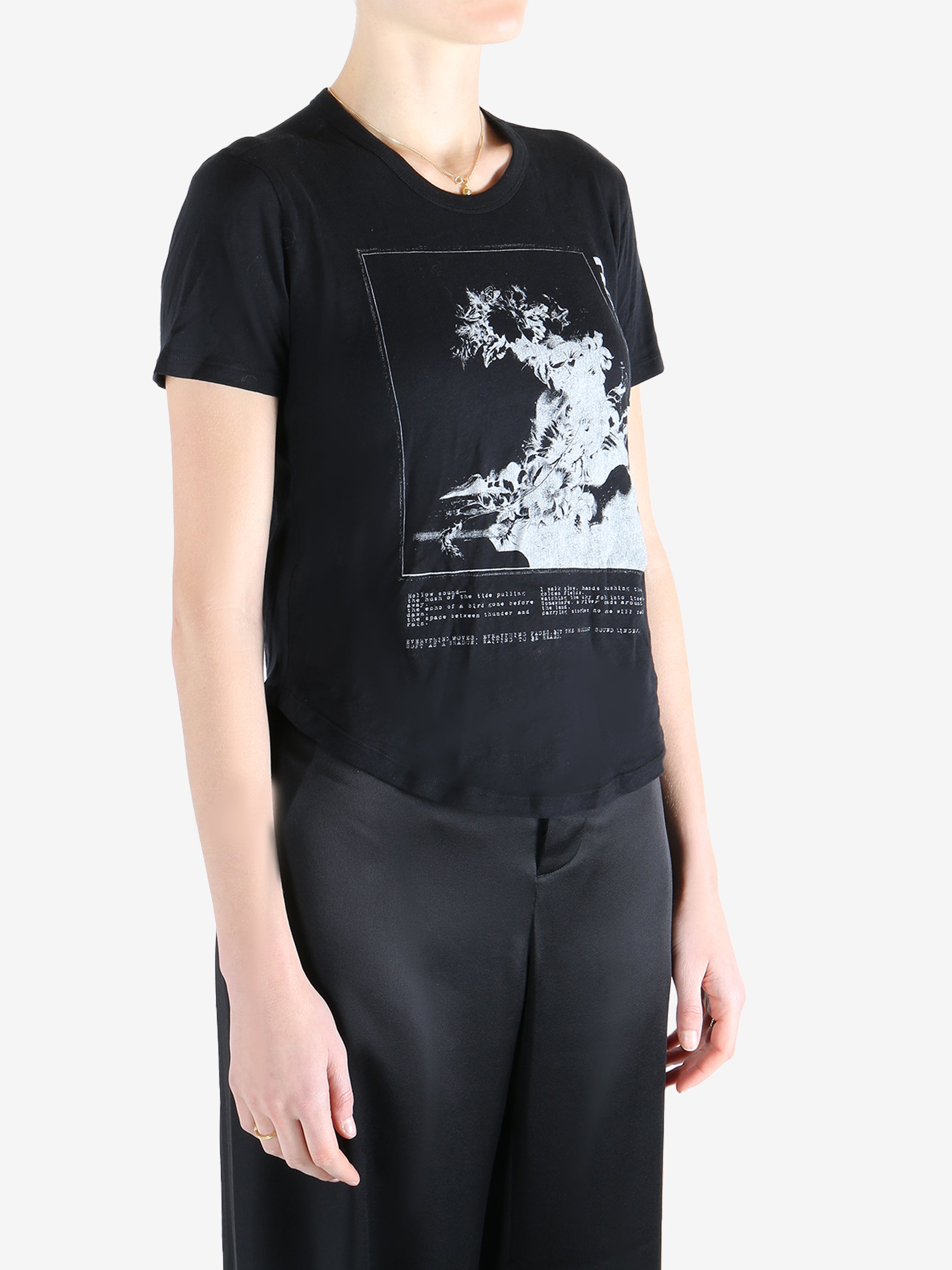 Black t-shirt worn by a person, showing the shirt's fit